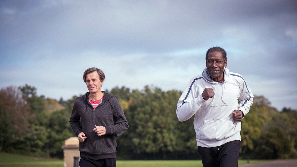 Two older men jogging
