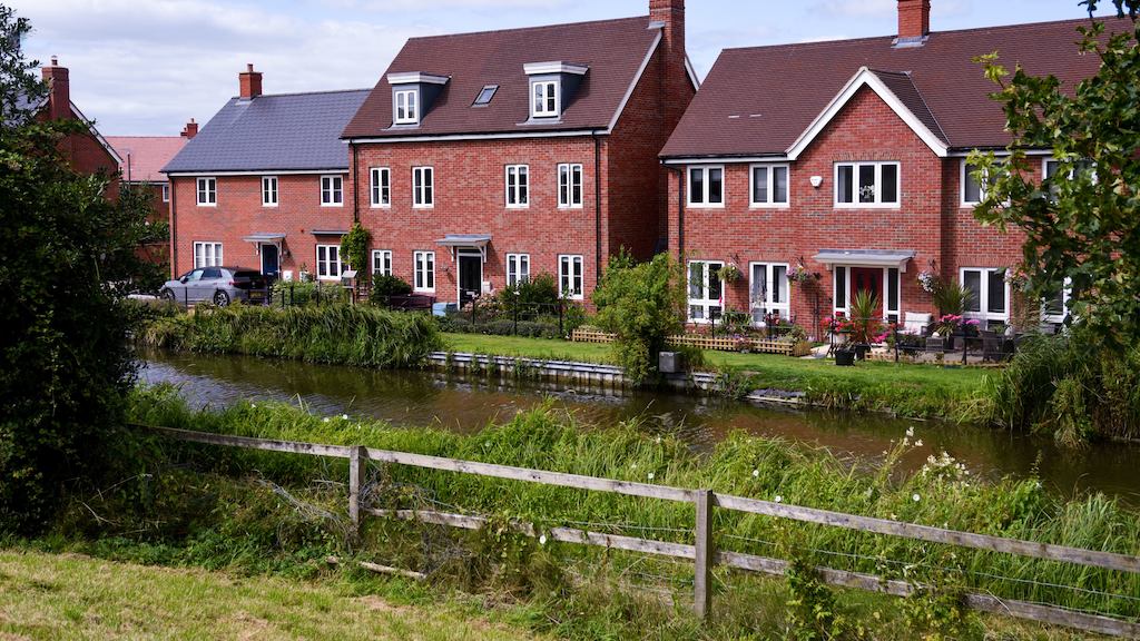 row of houses near a river