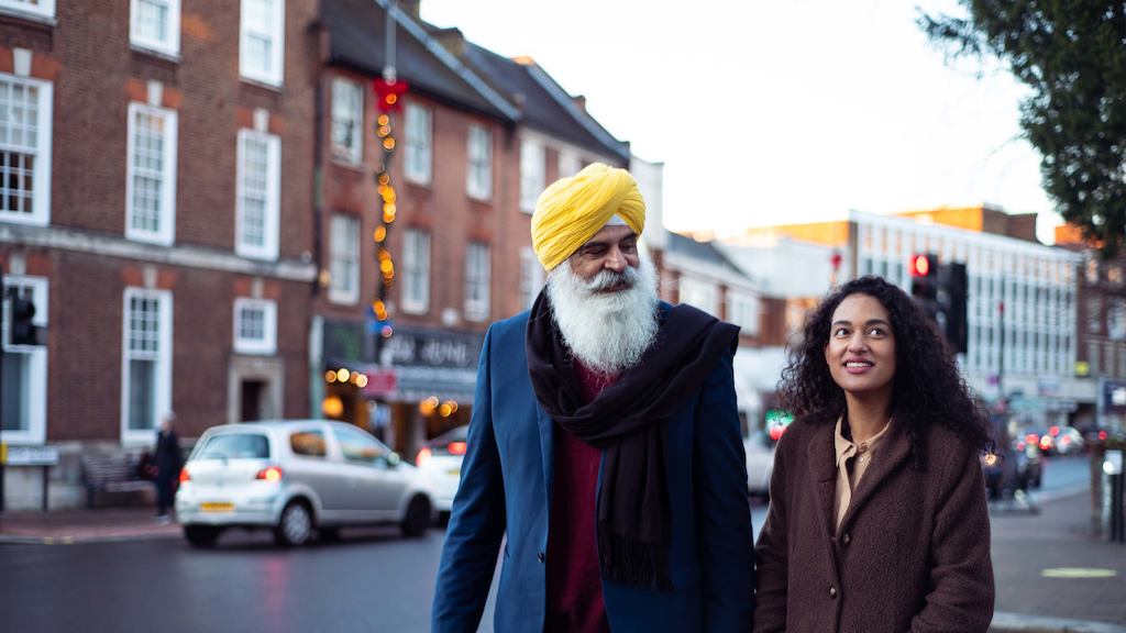 older man walking with younger woman