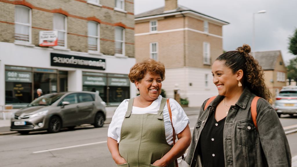 Older and younger people walking together