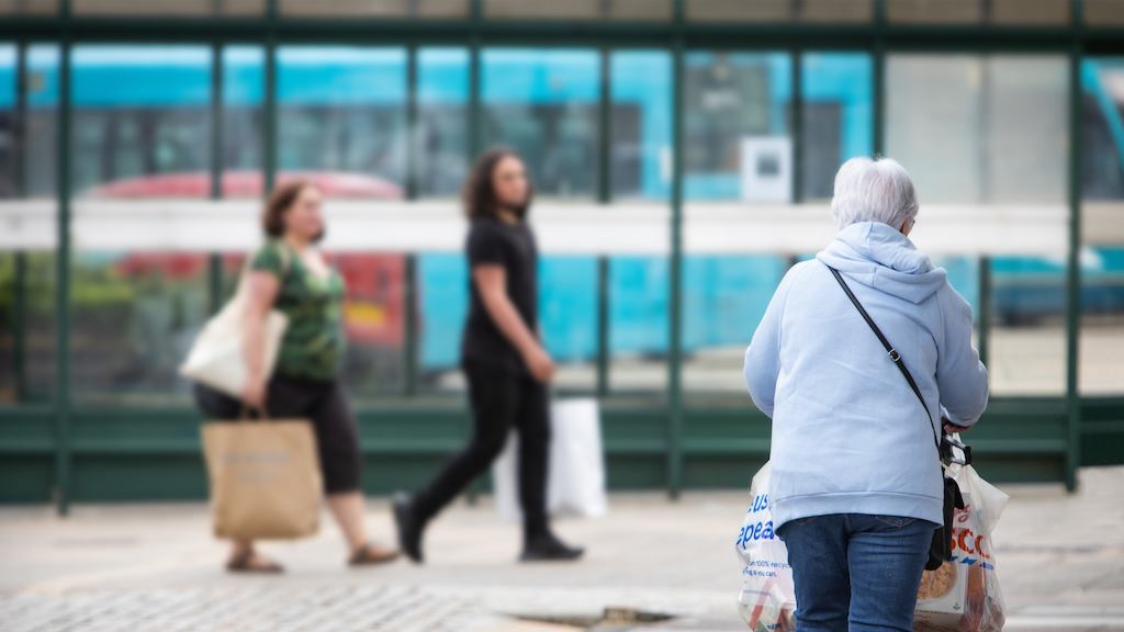 older woman walking down the street