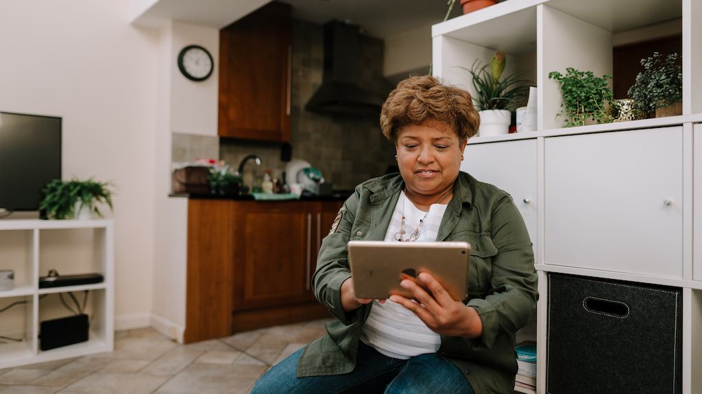 older woman using ipad