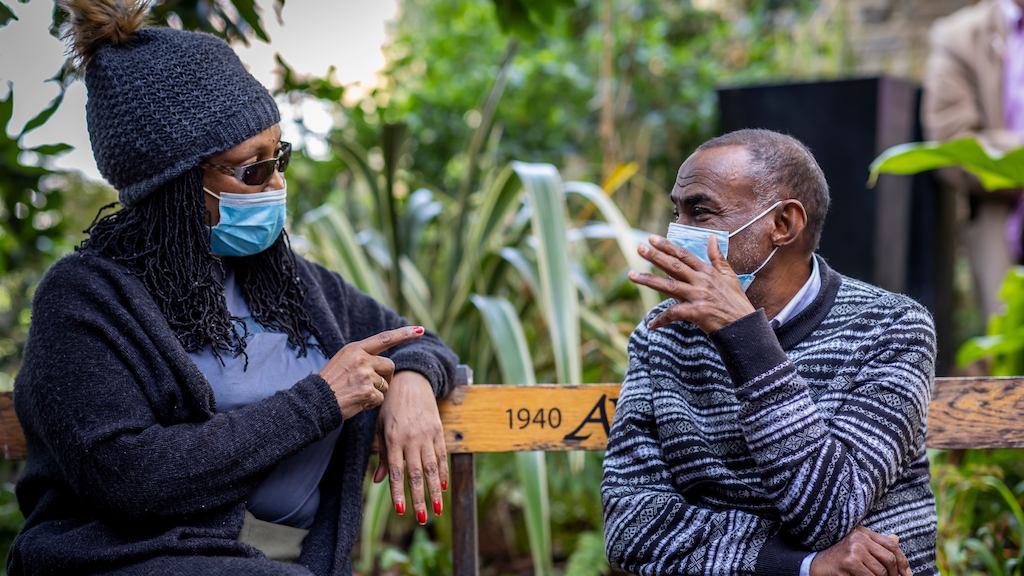 two older people talking