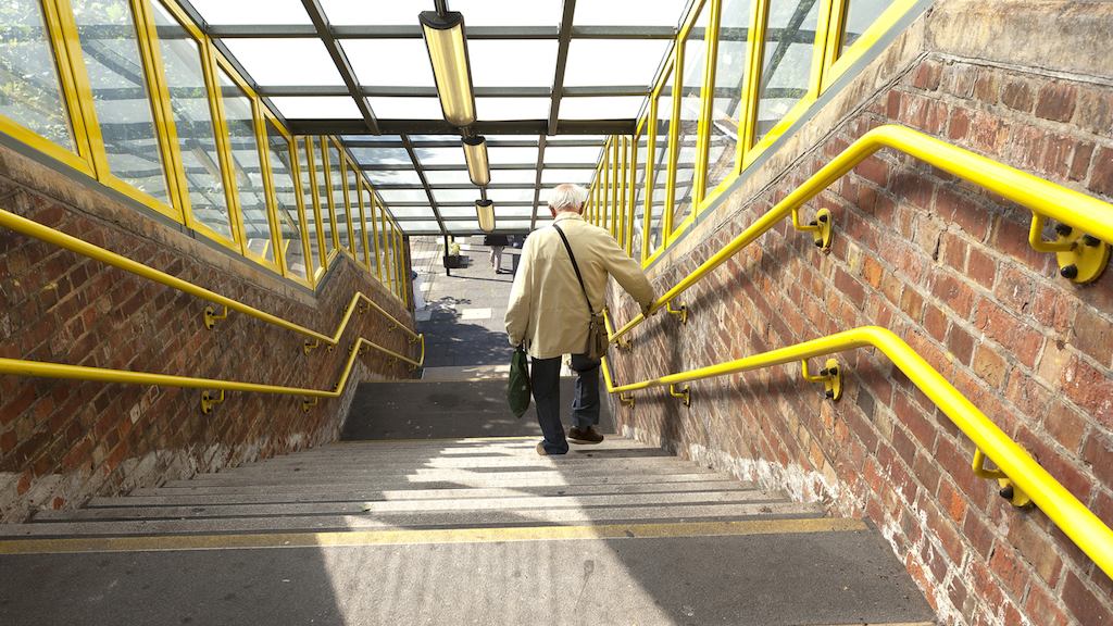 older man walking down the stairs