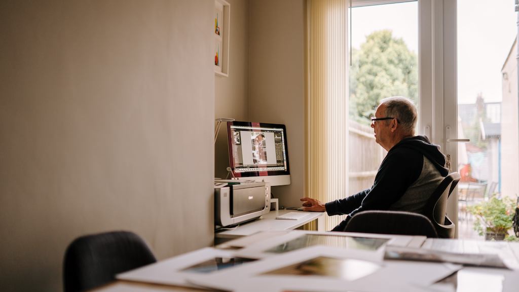 older man working from home