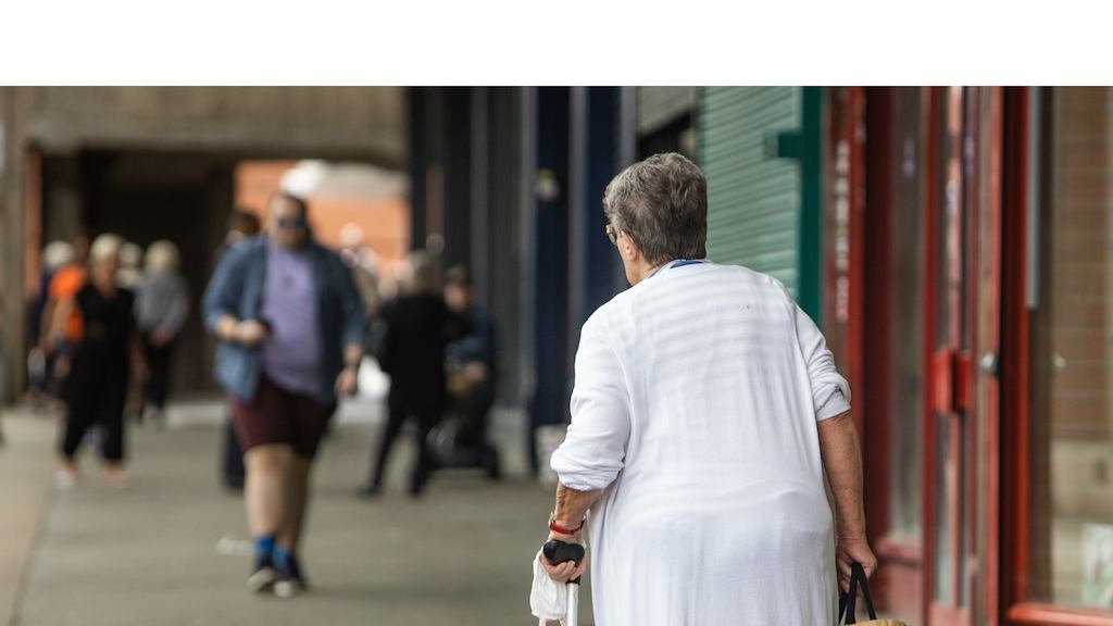 older woman walking down the street