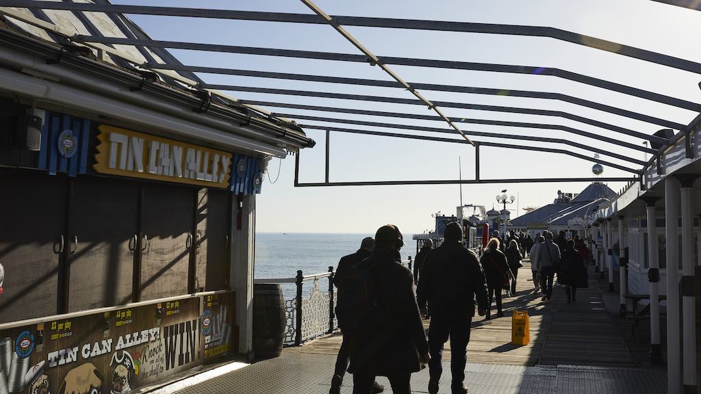 people walking on brighton pier
