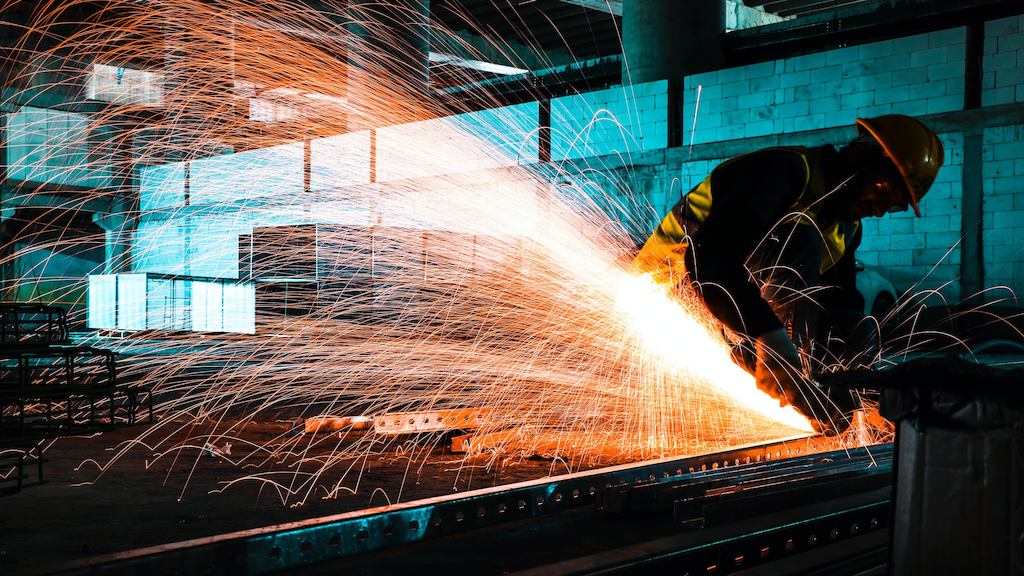 Worker using welding machine