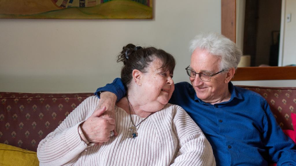 older couple sitting together on the sofa