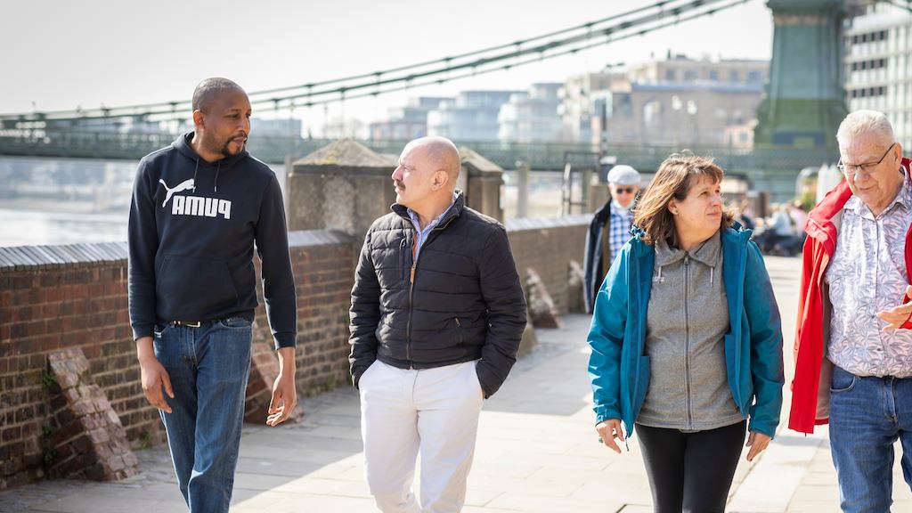 group of older people walking outside