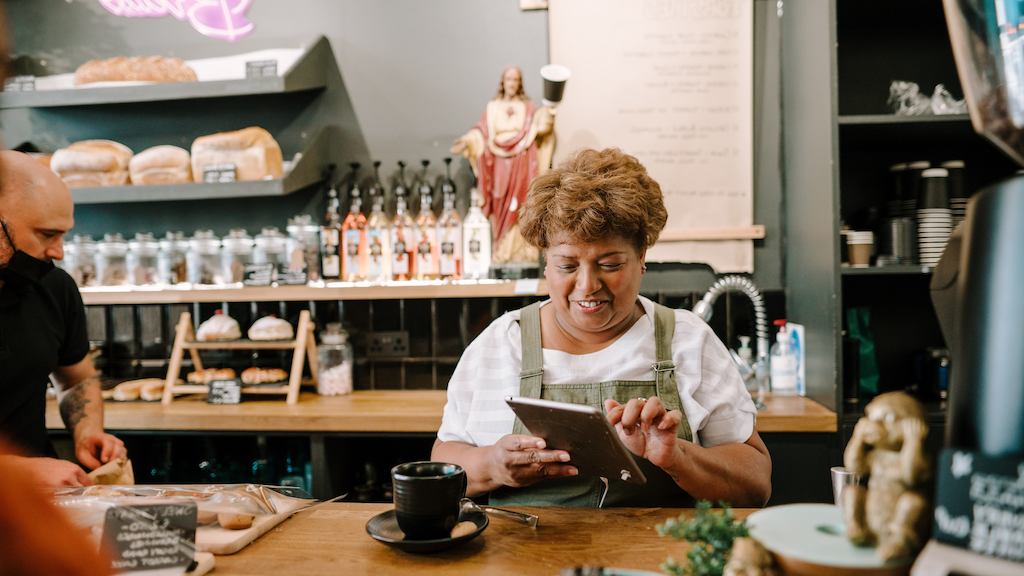 older woman working at a cafe
