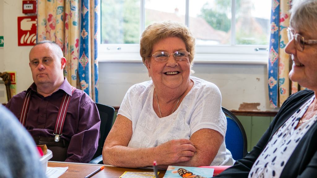 group of older people chatting together