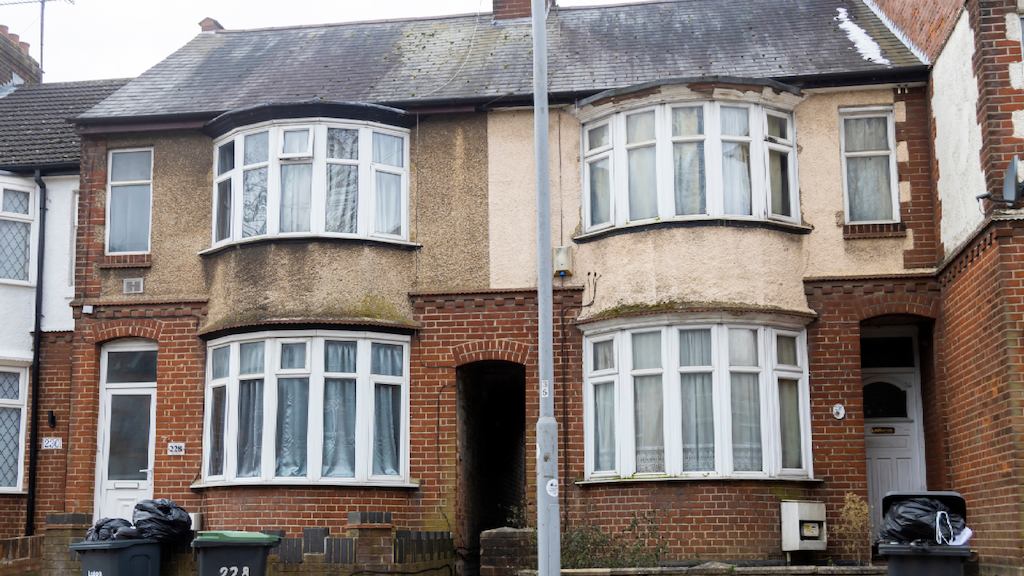 A row of houses with bay windows