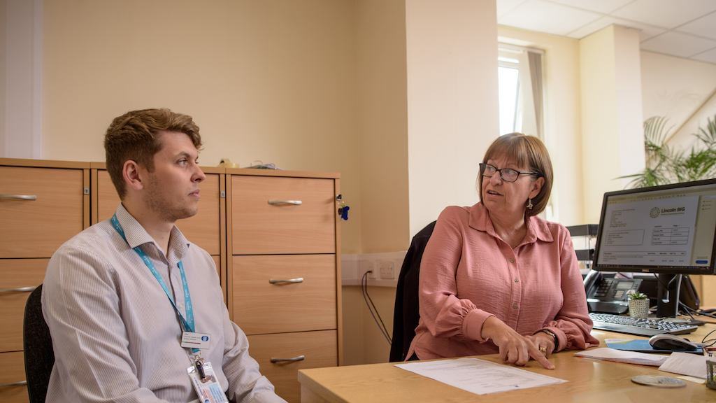 Two workers in an office