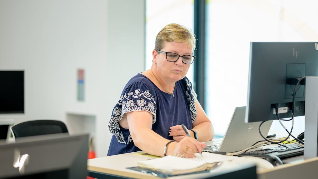 Older woman working at an office