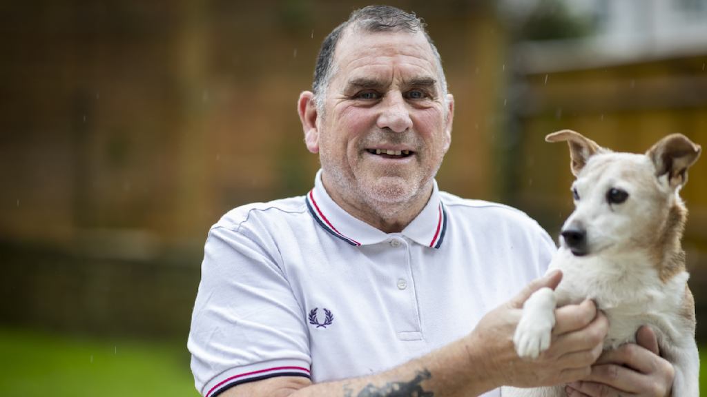 an older man with his dog