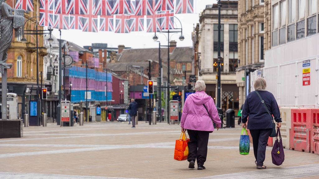 2 women walking down the street