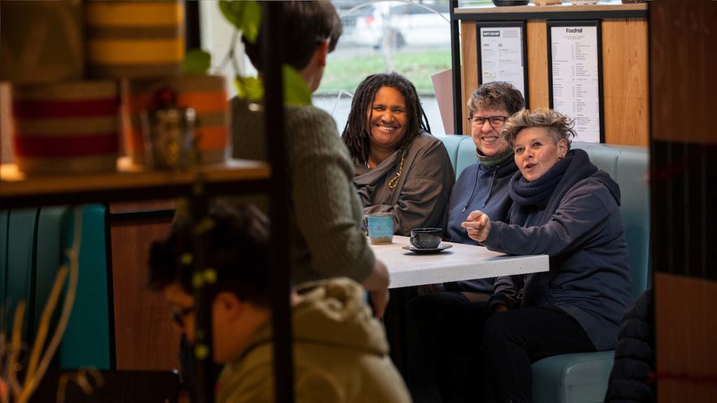 Group of older people chatting at a table