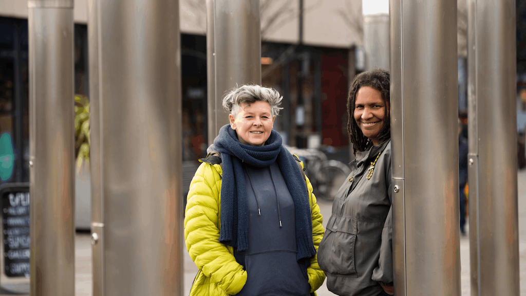 two women standing outside