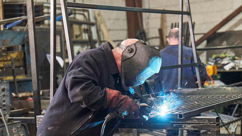 Older man working as a welder