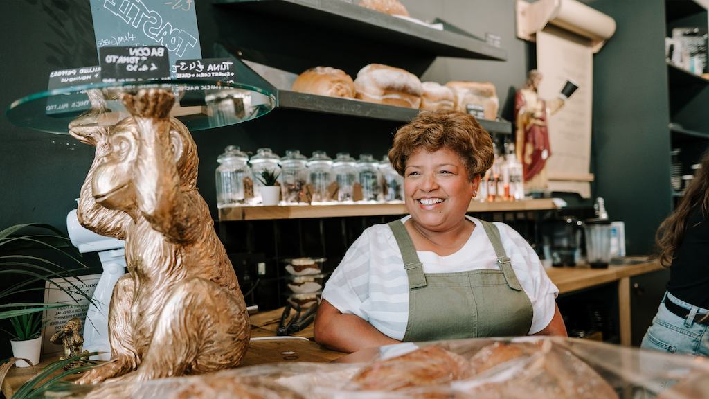 Older woman working at a cafe