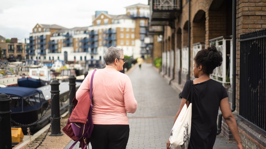 Two women walking down the street