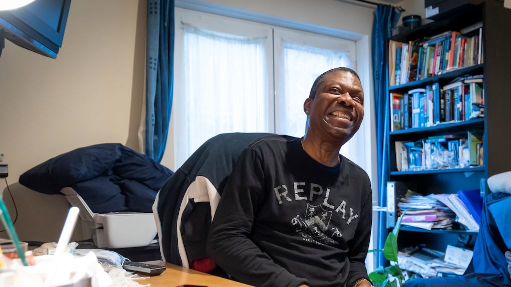 older man at home smiling