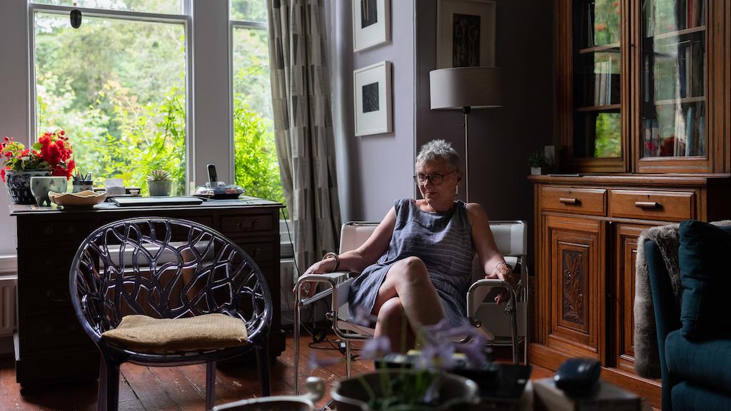 Older woman sat at home