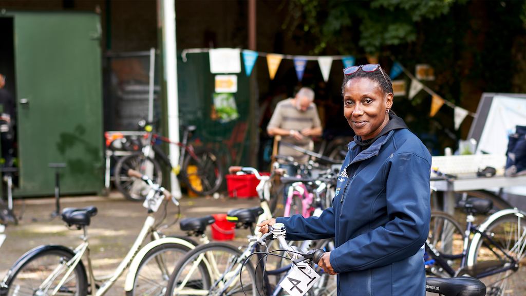 Older woman working with bikes