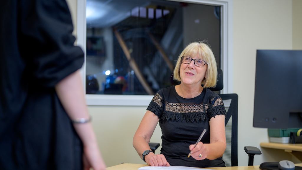 Older woman at desk