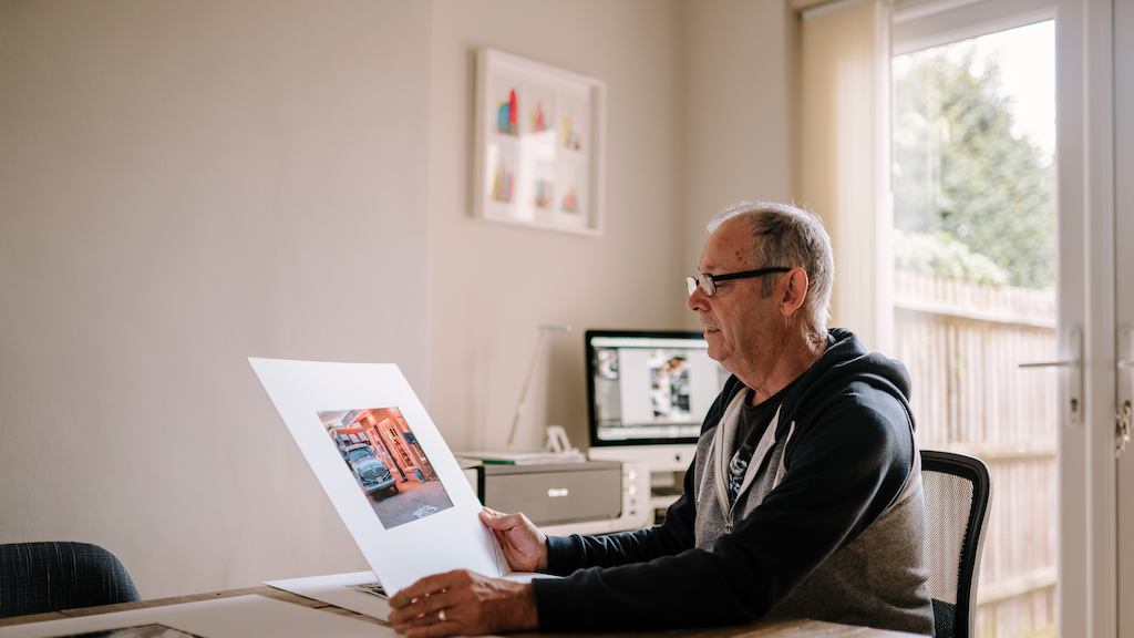 Older-man-looking-at-photos