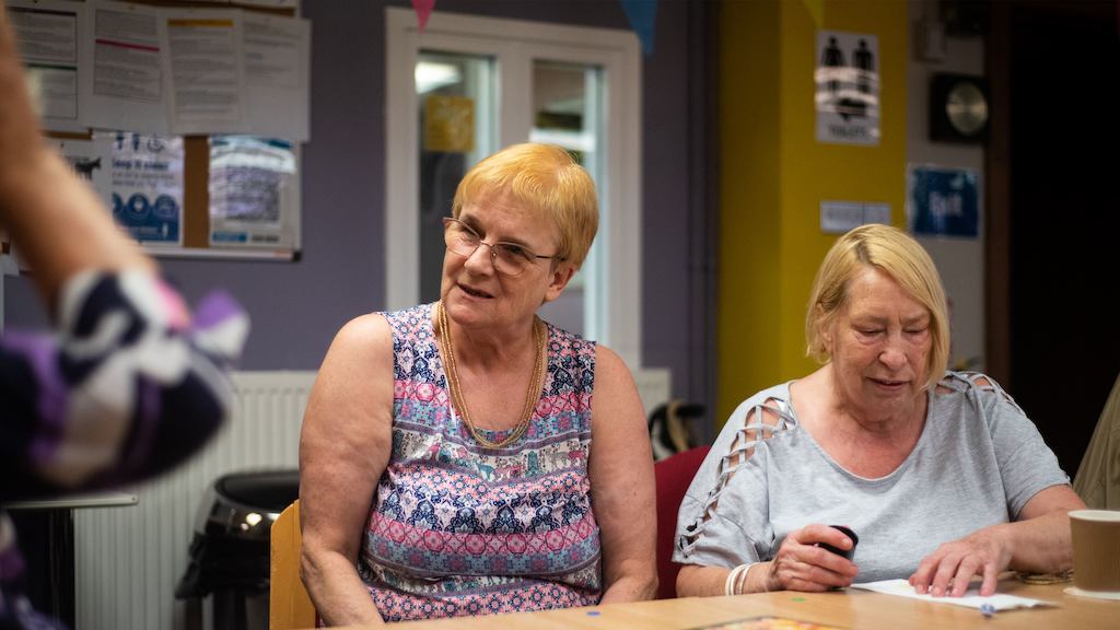 Older-women-socialising-at-a-table
