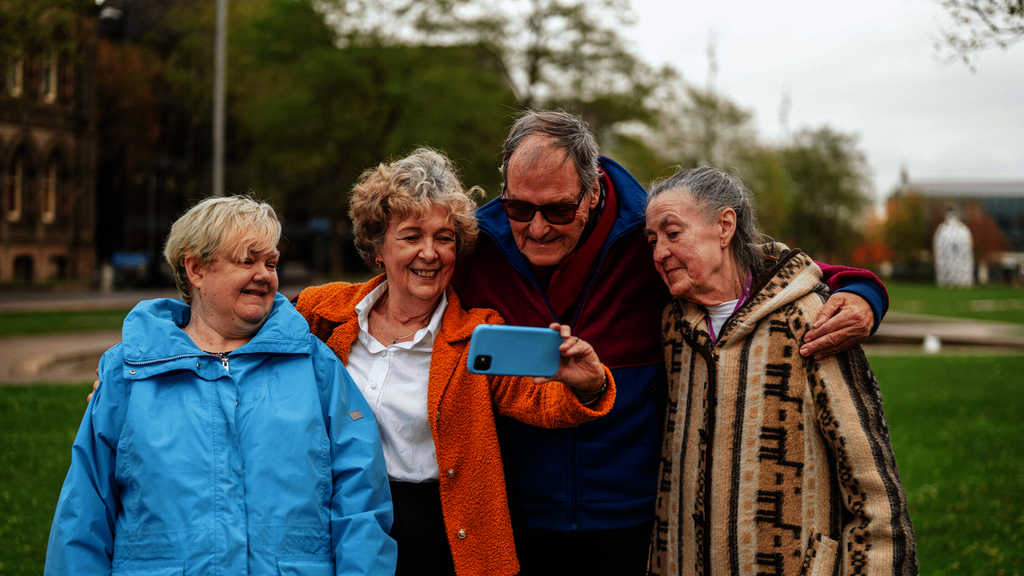 A group of older people taking a selfie