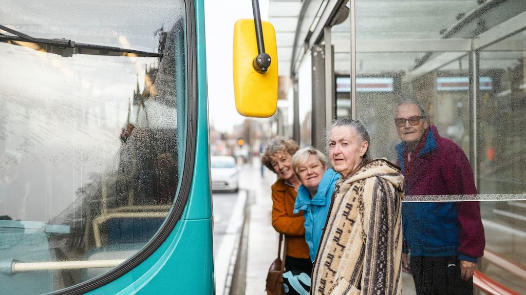 People at a bus stop
