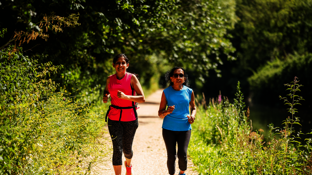 Two women jogging together