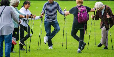 Group of people 'Nordic' walking in the park