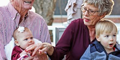 Older couple with young childrend