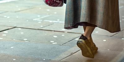Woman walking along the street