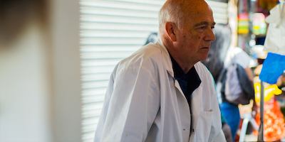 Older worker in market