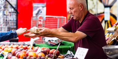 Man in the market selling fruit