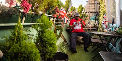 Older man in garden using mobile phone