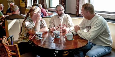 Group of people around a table in a cafe