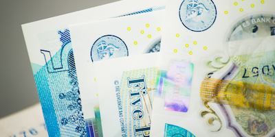 Five pound paper notes.