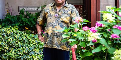Older man standing in garden