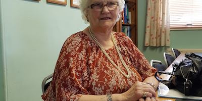 Photo of Diana by a desk