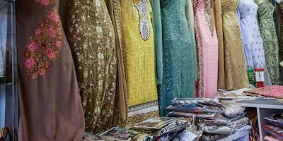 Collection of traditional East Asian dresses in a shop
