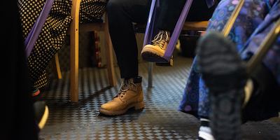 A person using a resistance band with their foot