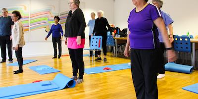 Older people in a yoga class