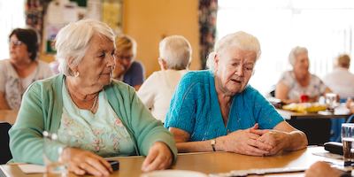 Older people playing dominoes