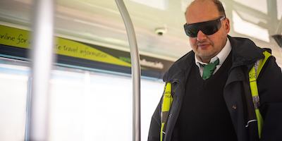 Man wearing visual impairment glassses